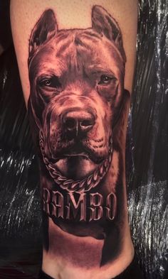 a man's leg with an image of a dog wearing a bandana on it