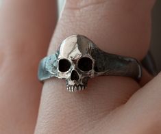 Skull Ring Men Version Materials: 925 sterling silver This Ring is made entirely by hand. give me time to do it for you Please note that actual colors may vary slightly from their appearance on screen. For more information, please visit my shop policies. If you have any questions, please do not hesitate to contact me. Delivery of the world Gift Skull-shaped Hallmarked Rings, Symbolic Hand-cast Skull Ring Gift, Handmade Adjustable Skull Ring Gift, Halloween Engraved Skull Ring Gift, Unique Skull Rings For Gifts, Unique Hand Forged Skull Ring Gift, Handmade Symbolic Sterling Silver Skull Ring, Hand Cast Silver Skull Ring For Gift, Sterling Silver Skull Ring Gift