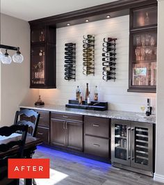 a kitchen with wine bottles on the wall