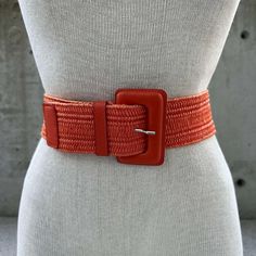 1980s orange raffia elastic belt, vintage straw waistband, beach boho dress belt, summer accessory, hamptons style, chic resort wear fashion Introducing the 1980s Orange Raffia Elastic Belt, a vintage treasure that seamlessly blends beach boho charm with chic resort wear fashion. This stunning belt is the epitome of summer elegance, designed to elevate your wardrobe with its unique texture and vibrant hue. Crafted from high-quality orange raffia, this elastic belt features a distinctive straw waistband that exudes a carefree, beachy vibe. The bright orange color adds a burst of energy to any outfit, making it the perfect accessory for sun-drenched days and balmy evenings. Its stretchy design ensures a comfortable fit, adapting to your silhouette with ease. Ideal for pairing with flowy maxi Chic Woven Belt For Beach, Chic Woven Belts For Beach, Raffia Belt, Resort Wear Fashion, Chic Resort Wear, Vintage Orange Clip-on Earrings, Vintage Hand-strung Orange Beads, Boho Beach Dress, Boho Aesthetic