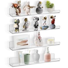 three clear shelves with various items on them and one is holding a plant, the other has an animal figurine