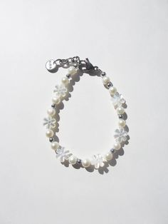 THE WHITE FLOWER PEARL BRACELET – Rimor Jewelry Handmade White Pearl Flower Bracelet, Handmade White Pearl Bracelet With Flower Shape, Handmade White Flower Pearl Bracelet, White Beaded Pearl Bracelet With Flower Shape, White Beaded Pearl Bracelet With Flower Design, White Beaded Flower Pearl Bracelet, White Flower Pearl Bracelet For Wedding, White Floral Pearl Bracelet For Weddings, Handmade White Pearl Beaded Bracelets