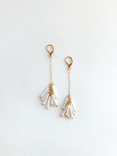 Earrings for your bridal party to wear on your big day and keep on wearing. Freshwater pearls are paired with white bugle beads for a super lightweight earring. + Pearls. Bugle Beads. 14K Gold Fill Lever Back Earrings. 14K Gold Fill Chain. + Length: 3 inches. + Earrings are ready to ship. + Your jewelry will come in a jewelry box, tied with a ribbon. ➤➤ Have a question about this product, reach out to me here ➙ https://www.etsy.com/conversations/new?with_id=9057464&referring_id=5772224&referring White Pearl Charm Drop Earrings For Bridal, White Pearl Charm Drop Bridal Earrings, White Dangle Earrings With Pearl Chain, White Pearl Charm Chandelier Earrings For Party, White Dangle Bridal Earrings With Pearl Charm, White Dangle Pearl Chain Earrings, White Beaded Pearl Earrings, White Pearl Beaded Drop Earrings, White Pearl Drop Beaded Earrings