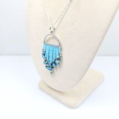 Our Pacific Blue Beaded Pendant boasts a unique beaded half-circle design, a perfect blend of contemporary and Bohemian style.  Each bead is delicately hand-strung to ensure every single piece is unique.  The pendant features an abundance of meticulously arranged crystal beads that dazzle with each movement, catching light from every angle. Despite its opulent appearance, this necklace offers exceptional comfort; it is lightweight and easy to wear, making it an ideal addition to both your everyday outfits and special occasion ensembles.  Wear it solo for a standout effect or layer it with other pieces for a more personalized look.    Handmade with love by CyntheCreations - because you deserve to feel extraordinary. 👉  Arrives in a gift box with bow, ready for giving 🎁 👉  Measurements: Gift Ideas For Her, Silver Flats, Pacific Blue, Czech Crystal, Half Circle, Bead Jewelry, Seed Bead Jewelry, Circle Design, Handmade Artisan