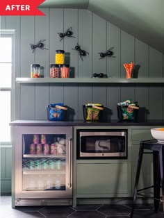 a kitchen with an oven, refrigerator and shelves filled with food on top of it