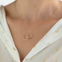 "14k Solid Gold Interwined Necklace ★ ★ ★Description★ ★ ★ ✓ Material: 14k Real Solid Gold ✓ Available Gold Colors: Yellow Gold, White Gold and Rose Gold ✓ Available Chain Sizes: 14\", 16\", 18\", 20\" ✓ Charm/Pendant Material: 14k Gold ✓ Charm/Pendant Size : Height: 0.6\", Width: 1.05\" ✓ Ready to Ship in 3-4 Business Days ✓ International ★FREE★ Express Shipping ★ ★ Each order will be packed in a beautiful gift box★ ★ Want to find out more? Check out my shop ⬇ https://www.etsy.com/shop/BaccaGold 14k Gold Filled Elegant Jewelry, Fine Jewelry In 14k Gold Circle Shape, Elegant 14k Gold Filled Circle Jewelry, 14k Gold Circular Jewelry For Anniversary, Modern 14k Gold-filled Jewelry For Wedding, Modern 14k Gold Filled Jewelry For Wedding, Fine Jewelry Circle-shaped Anniversary Gift, Delicate 14k Stamped Jewelry For Anniversary, Minimalist Round Jewelry For Anniversary