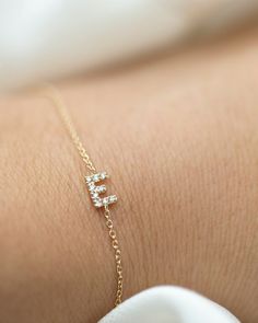 Personalized 14k solid gold mini diamond letter bracelet! Simple, minimalist everyday bracelet - Perfect dainty everyday bracelet with a sparkle.Personalize this bracelet with your choice of uppercase alphabet Initial. Great as a gift for special someone or for yourself. Each initial measures approx.5mm, You can add up to 5 Initials Available in 14K Yellow Gold or 14K White Gold * Leave us your initials and placement in the comment box at checkout. Cheap Gold Letter-shaped Bracelets, Personalized Diamond Bracelet For Everyday Wear, Dainty White Gold Name Bracelet, Personalized Yellow Gold Diamond Bracelet For Everyday, Dainty Personalized Diamond Bracelet As Gift, Dainty Personalized Diamond Bracelet For Gift, Dainty Diamond Accented Bracelets For Everyday, Minimalist White Gold Name Bracelet For Everyday, Personalized Minimalist Diamond Bracelet For Anniversary