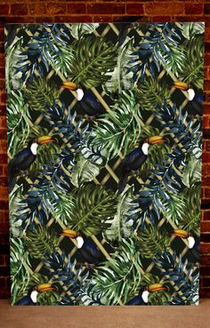 an image of tropical leaves and toucan birds on a brick wall in front of a