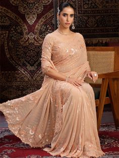 This attractive peach sequins georgette festival wear saree with blouse is the perfect choice for weddings, festivals, parties, and other special occasions.
The vibrant peach color will make you stand out in the crowd, while the intricate sequin work, thread embroidery, and zari work add a touch of elegance and glamour to the saree.
The saree comes in a 5.50-meter length, along with unstitched blouse material, giving you the flexibility to customize it as per your preference. The georgette fabri Luxury Peach Saree For Festive Occasions, Anarkali Peach Saree With Zari Work, Peach Anarkali Saree With Zari Work, Peach Georgette Traditional Wear With Pallu, Unstitched Peach Blouse Piece For Navratri, Unstitched Peach Blouse Piece For Diwali, Peach Unstitched Blouse Piece For Navratri, Peach Georgette Traditional Wear For Festivals, Festive Peach Saree With Zari Work