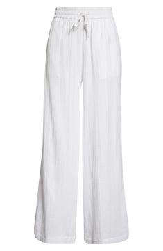 Cut from soft cotton gauze, these cover-up pants feature handy pockets and an easy-fitting drawstring waist. 29" inseam; 27 1/2" leg opening; 13 1/2" front rise; 18" back rise (size Medium) Drawstring waist Side-seam pockets 100% cotton Machine wash, line dry Imported White Breezy Loungewear Bottoms, Breezy White Loungewear Bottoms, Breezy White Bottoms With Relaxed Fit, Cotton Wide Leg Pants For Beach Season, White Beachwear Pants With Elastic Waistband, White Breezy Wide Leg Bottoms, Cotton Ankle-length Wide Leg Pants For Beach, Breezy White Wide Leg Bottoms, Cotton Wide Leg Ankle-length Pants For Beach