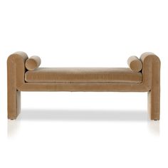 a tan leather bench with two round legs and an upholstered cushion on the back