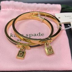 2 Gorgeous Kate Spade Bangles With Dangling Spade Charms One All Gold, One With Black Around The Band Brand New With Tags Comes In One Dust Bag Same/Next Day Quick Holiday Shipping Gold-tone Fashion Accessory Jewelry, Adjustable Gold-tone Jewelry For Gifts, Elegant Metal Jewelry With Lock Detail, Elegant Metal Jewelry With Lock, Gold-tone Hardware Bracelets As Gift, Metal Jewelry With Lock, Kate Spade Gold Bracelets, Rose Gold Bangle Bracelet, Kate Spade Bracelet