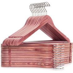 a stack of wooden clothes hangers on a white background