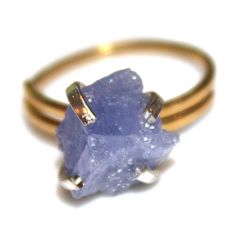 This raw tanzanite nugget ring is rustic and delicate! An gold vermeil shank with sterling silver prong ring is adorned with a lovely raw lavender nugget of natural tanzanite. This ring is adjustable but is best for ring sizes between 5 and 8 1/2. Love! xoxoxo payton For more cool jewelry looks, check out http://www.etsy.com/shop/FizzCandy All FizzCandy creations come beautifully boxed and ready for gift giving. Please see our store policies here - https://www.etsy.com/shop/FizzCandy/policy?ref= Adjustable Gold Rings With Raw Stone, Gold Ring With Raw Stone For Healing, Gold Jewelry With Raw Stone For Promise Ring, Lavender Jewelry, Lavender Ring, Lavender Jewellery, Raw Tanzanite, Cool Jewelry, Prong Ring