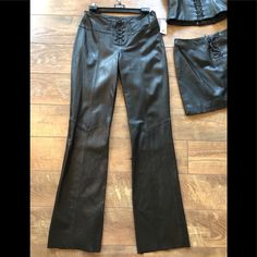 This Price Is For The Pant Only! New Tags Supple Napa Leather Lined Flare Leg Mid Rise Lace Up Pant. 8” Invisible Side Zip Metal Grommet Leather Lace Up Front Opening Adjust Fit Waist. Waist Band 3”Wide. The Rise In Front Is 9 1/2” The Rise In The Back Is 14 1/4”. The Waist Is 28 1/2” As Pictured The Hips Are 38-39” Leg Opening At Hem Is 18 1/2”. Inseam 34”With A Raw Edge Hem May Be Cut Off Or Glued Up To Shorten. Real Leather No Damage Non-Smoker No Pets. C Separate Listings 4 Matched Skirt Sol Designer Black Leather Bottoms, Designer Fitted Trousers, Designer Fitted Wide Leg Bottoms, Designer Fitted Wide Leg Pants, Designer Black Bottoms For Night Out, Designer Fitted Leather Bottoms, Designer Leather Bottoms, Designer Fitted Black Leather Pants, Designer Fitted Pants For Work