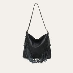 Discover Elegant Style and Functionality Embrace the perfect blend of fashion and practicality with our Luxurious Vegan Leather Tassel Shoulder Bag. Designed for the modern woman, this versatile hobo crossbody handbag is a must-have accessory for any wardrobe. Made from high-quality PU vegan leather, this bag is not only stylish but also ethically conscious. The elegant tassel decoration adds a bohemian touch, making it ideal for both casual and formal occasions. Key Features Material: High-grade PU Vegan Leather Spacious Interior: Includes a zipper pocket and a slot pocket Convenient Exterior: Features a back zipper pocket for easy access Secure Closure: Reliable zipper to keep your belongings safe Single Shoulder Strap: For comfortable carrying as a shoulder or crossbody bag Size: Genero Chic Travel Bag With Fringe, Fall Hobo Bag With Adjustable Strap, Fall Hobo Bag With Adjustable Strap For Errands, Trendy Fringe Satchel Shoulder Bag, Trendy Fringed Satchel Shoulder Bag, Versatile Crossbody Hobo Bag For Fall, Chic Fringe Bags For Fall, Trendy Soft Leather Crossbody Hobo Bag, Chic Travel Hobo Bag With Fringe