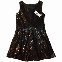 Gap Kids Factory Sequin Tank Party Dress Color: "Moonless Night" Allover Sequins Mesh Trim At Neck And Arm Holes Zipper Closure At Back Seam At Waist Fully Lined Tulle At Underskirt For Added Fullness Shell And Lining: 100% Polyester Machine Wash Cold Size: S (6-7) New With Tag Original Retail Price: $44.99 Moonless Night, Sequin Tank, Gap Kids, Black Sequins, Kids' Dresses, Colorful Dresses, Gap, Sequin, Party Dress