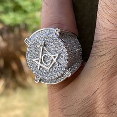 925 sterling silver Masonic symbol ring. Choose ring from size 7 and up to size 10. Stamped on the inside of the band "925". Features a raised Masonic symbol on center. Nicely iced with high quality CZ stones. Solid pieces weigh 15 to 17 grams each. Genuine 925 sterling silver precious metal. Rhodium finish over solid 925 sterling silver. Real silver that won't turn your fingers green. 100% FREE SHIPPING in USA. Order now!. Mason Ring, Masonic Symbol, Dental Impressions, Custom Grillz, Masonic Symbols, Masonic Ring, Mold Kit, Hip Hop Jewelry, Cz Stone