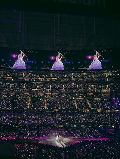 performers perform on stage in front of an audience at the olympics opening ceremony, london