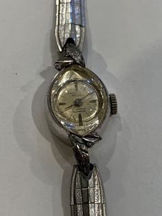 Vintage Lady Michell 21 Jewel Wind Watch Silver Tone.   There are slight scratches on the watch as would be expected for it's age. Overall this is a very classy watch with beautiful leaf patterns on the case front.    Exported By ExportYourStore :) SKU:184990786532_32c62aed-4527* Classy Watch, Vintage Timepiece, Leaf Patterns, Vintage Lady, Hinged Bangle, Wrist Watches, Leaf Pattern, Silver Watch, Jewellery And Watches