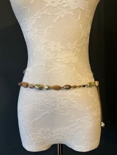 High quality metal chain & Marble Bead belt.  Exclusively designed by FAN Design, this belt is made to a wide range of sizes. Matching necklace also available.  Choose your waist size in inches, all belts will come with an extra 12 inch hanging chain Tap into the hottest new trend with chain belts! This chic piece of bodywear can be draped over your clothing to enhance your outfit or worn with bare midriff looks. Pair it with a simple black ensemble for an elegant finish. Perfect accessory for a Bohemian Beaded Waist Chain, Bohemian Adjustable Chain Belt, Bohemian Style Adjustable Chain Belt, Bead Belt, Elegant Swimwear, Beads Fashion, Belt Vintage, Chain Belts, Beaded Belt