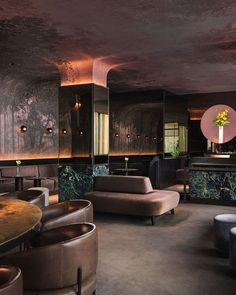 the interior of a bar with chairs and tables