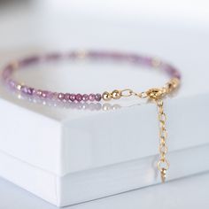 Who doesn't love Pink? Check out this gorgeous, sparkly Pink Ombre Moonstone Bracelet with a 14K gold-filled adjustable chain that includes a quality stamped heart tag. The bracelet adds just the right amount of sparkle to any outfit. It is dainty and feminine and perfect to wear solo or for stacking with our other bead bracelets.. Waterproof and tarnish resistant!  Adjustable Clasp: Whether you have a tiny wrist or need a bit more room, this bracelet fits comfortably thanks to the adjustable cl Adjustable Faceted 14k Gold Filled Bracelets, 14k Gold Filled Faceted Bracelets For Gift, Adjustable Gold Gemstone Bracelet Gift, Adjustable Gemstone Gold Bracelet For Gifts, Adjustable Gemstone Gold Bracelet As A Gift, Adjustable Faceted Rose Gold Bracelet, Adjustable Gold Heart Bracelet With Birthstone, Heart Tag, Moonstone Bracelet