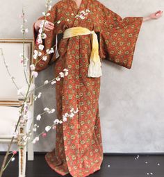 This kimono features silk chirimen base with exotic print. Handcrafted in Japan  In excellent condition  Dry Clean only  BELT NOT INCLUDED Approximate measurements for reference:  Length (along central back seam): 148cm Sleeve Length: 32cm Sleeve Width: 45cm Underarm to Underarm (top bust half circle):  59cm Left Sleeve edge to Right sleeve edge ( total length of two sleeves plus shoulder width): 125cm All vintage and pre-loved unicorn items have their stories. There may be some signs of wear, t Vintage Floral Print Kimono For Festival, Vintage Floral Print Festival Kimono, Silk Floral Print Kimono For Festivals, Floral Print Kimono For Tea Ceremony, Traditional Printed Kimono For Festivals, Brown Long Kimono For Festival, Long Brown Kimono For Festival, Traditional Silk Kimono With Floral Print, Traditional Long Printed Kimono