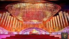 the interior of a church decorated with lights and chandeliers