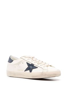 Find GOLDEN GOOSE DELUXE BRAND Super Star Leather Sneakers on Editorialist. Super-Star lace-up sneakers from Golden Goose featuring white/black, calf leather, signature star patch to the sides, distressed finish, contrasting branded heel counter, front lace-up fastening, round toe and flat rubber sole. Heel 1 in / 2,5 cm; Platform 0,8 in / 2 cm Goose Sneakers, Chic Sneakers, Golden Goose Sneakers, Sneaker Games, Star Sneakers, Super Star, Leather Cap, Golden Goose, Stylish Men