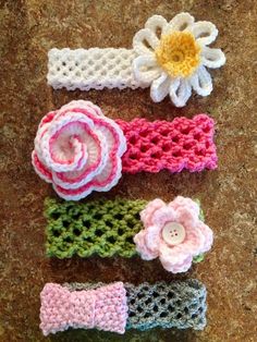 four crocheted headbands with flowers on them