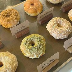 there are many different types of donuts on display