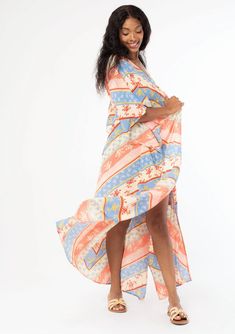 A versatile bohemian beach duster kimono in a bold red and indigo blue floral chevron stripe. FINAL SALE Floral chevron stripe Crinkle gauze Relaxed, flowy fit Kimono sleeves Maxi length Billowy silhouette Long & lightweight Tassel tie front closure Just in time for Summer, this lightweight beach cover-up features half-length kimono sleeves, a billowy silhouette, and an adjustable tassel tie waist. We love to style it open over cut-off shorts or style it closed over a bathing suit for a relaxing Striped Kaftan For Summer Beach Cover-up, Spring Beach Long Duster, Long Spring Beach Duster, Long Beach Duster For Spring, Bohemian Flowy Kimono With Short Sleeves, Flowy Bohemian Kimono With Short Sleeves, Bohemian Short Sleeve Flowy Kimono, Bohemian Spring Beach Duster Cover-up, Summer Multicolor Ikat Print Kimono