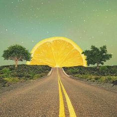 an orange slice sitting on the middle of a road with trees and stars in the background