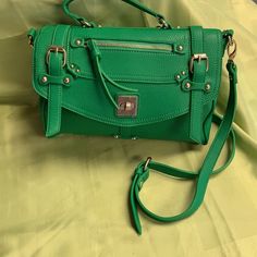 Detachable Shoulder Strap Converts To Handbag. Gold Tone Hardware. Trendy Green Satchel For Travel, Green Satchel With Hasp Closure For Travel, Green Satchel With Hasp Closure For Everyday Use, Trendy Satchel With Fold Over Clasp For Daily Use, Trendy Daily Use Satchel With Fold Over Clasp, Green Satchel With Hasp Closure, Green Travel Bag With Hasp Closure, Green Flap Satchel For Everyday Use, Green Crossbody Satchel With Zipper Closure