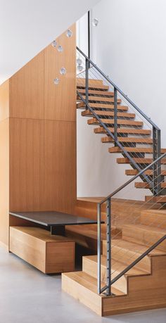 the stairs are made of wood and metal