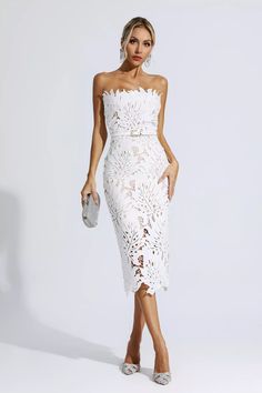 The Jazlyn White Floral Lace Midi Dress is the perfect finishing touch to any outfit. Its lace fabric and midi length create a classic and timeless look, while the strapless design makes it ideal for any special occasion. Enjoy a sophisticated, feminine finish all night long. Simply complete the look with heels.Dress Length: Approx 96cmMaterials: PolyesterGentle Dry Clean OnlyThe model is 5 ft 74 and wears size SColor may vary due to lighting on images. The product images (without a model) are Glitter Wedding Dress, Rehearsal Dinner Dresses, Bandage Midi Dress, White Lace Dress, Floral Shirt Dress, Puff Sleeve Dresses, Looks Chic, Lace Midi, Lace Midi Dress