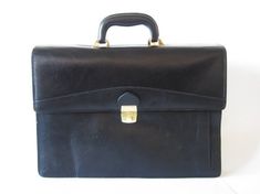 "Vintage Black Leather Briefcase Retro Laptop Notebook Bag Messenger Bag Portfolio Mac Book Pro Bag Genuine Leather Business File Bag with Golden Clasp Measures: 16\" X 11.5\" Condition: Very good vintage condition Questions are always welcome! SHIPPING * I ship worldwide via Priority mail (Latvijas Pasts) from Latvia (EU). * I ship from Europe, so please allow 2 to 3 weeks for the package to arrive if you live overseas. * Europe 5 - 10 business days. Go back to my shop: YourEclecticStreet.etsy.com P.S. why buy Vintage? - Vintage is Unique! - Vintage is Eco Friendly! - Vintage is Inspirational! - Vintage is History! - Vintage is an Investment! Enjoy!" Bag Portfolio, Macbook Pro Bag, White Winter Jacket, Steampunk Vest, Mac Book Pro, Black Leather Briefcase, Plaid Jacket Women, Plaid Hoodie, Notebook Bag