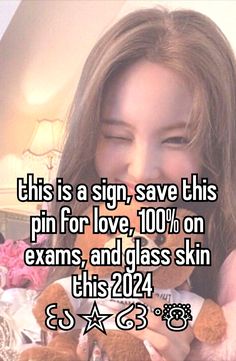 a girl holding a teddy bear with the caption this is a sign, save this pin for love, 100 % on exam and glass skin this 2012