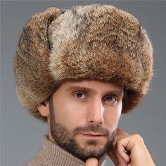 Stay warm and stylish in the snow with our Men's Earflap Russian Style Snowy Weather Hat! Made with high-quality, thick materials, this hat is perfect for keeping your head and ears warm in even the coldest of temperatures. The Russian-style design adds a unique and fashionable touch to your winter wardrobe, while the earflaps provide extra protection from the wind and cold. Made with a blend of cotton and polyester, this hat is not only comfortable but also durable and long-lasting. Don't let t Trapper Hat Men, Fur Trapper Hat, Winter Fur Hat, Russian Hat, Rabbit Fur Hat, Ski Cap, Trapper Hat, Winter Hats For Men, Trapper Hats