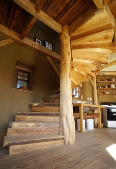 a wooden spiral staircase design in a house