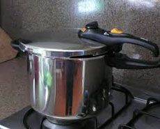 a stainless steel pot sitting on top of a stove