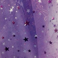 purple and silver stars are on the sheered fabric with sequins in it