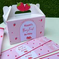 a pink birthday box with strawberries on it