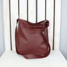 "If you value sophisticated accessories and you're looking for a multifunctional bag in gorgeous color, you are in a good place. This simple burgundy hobo purse looks great as shoulder or crossbody tote. Fits really well with any womens casual outfit. Made of high quality vegan leather. One of the bags perfect for everyday use - for work, shopping or little talks with your best friend. Easy to pack, large enough for all your items on the go. Cotton lining with three pockets, one of them fastened Trendy Soft Leather Crossbody Hobo Bag, Versatile Hobo Bag For Shopping With Zipper Pocket, Fall Tote Hobo Bag For Daily Use, Fall Hobo Tote Bag For Daily Use, Everyday Faux Leather Hobo Shoulder Bag, Fall Soft Leather Everyday Shoulder Bag, Large Capacity Crossbody Hobo Bag, Versatile Hobo Bag With Zipper Pocket For Shopping, Versatile Faux Leather Hobo Bag Crossbody