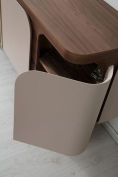 a close up of a wooden cabinet with an open drawer on the front and side