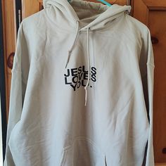 This Is The Highly Sought After Jesus Loves You Check Front For Good News Sand Colored Hoodie It Is Brand New! So Soft. Arm Head To Armpit Measures 25.5 Inches Jesus Hoodies Aesthetic, Jesus Loves You Hoodie, Jesus Loves You Shirt, Christian Hoodie Design, Jesus Sweaters, Cool Jesus, Jesus Sweater, Christian Clothing Brand, Jesus Clothes