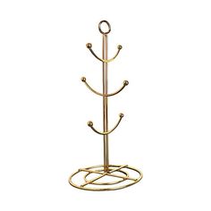 a gold plated metal rack with three hooks and two rings on the bottom shelf