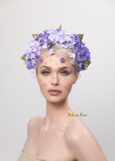 2023 collection, pretty lavender/purple Vintage ombre lilac flowers made of starched fabric with satin leaves with purple shades, seated on a custom-made satin headband and delicate face netting with crystals and few lilacs resting on the netting. Headband has a comb in the middle. All my hats are hand made to order, if this is a rush order please contact me before ordering. Hat box included for domestic orders only. For international orders, headpiece will be nicely packed to protect it during Lilac Fascinator Hats, Lilac Headpiece, Kentucky Derby Headband, Lilac Fascinator, Derby Headband, Palm Royale, Fascinator Hats Outfit, Art Hats, Delicate Face