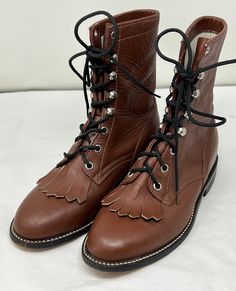 "Vintage COWTOWN Brown Roper Boots SIZE: US Women 6D (Wide)---Marked as Boys 4D WIDTH:  3 1/2\" LENGTH OUTSOLE: 10\" HEIGHT: 8\" HEEL: 1 \" MATERIAL: Leather  COLOR: BROWN Made by Cowtown NOTE: Shoes show light signs of wear on soles, heels and uppers consistent to pre-owned shoes." Western Brown Lace-up Boots For Winter, Western Style Brown Lace-up Boots For Winter, Fitted High-top Moto Boots For Fall, Fitted Boots With Reinforced Toe For Fall, Brown Western Lace-up Moto Boots, Round Toe Moto Boots For Ranch In Winter, Fitted Round Toe Boots For Western-themed Events, Brown Western Lace-up Boots With Round Toe, Brown Western Style Lace-up Boots With Round Toe